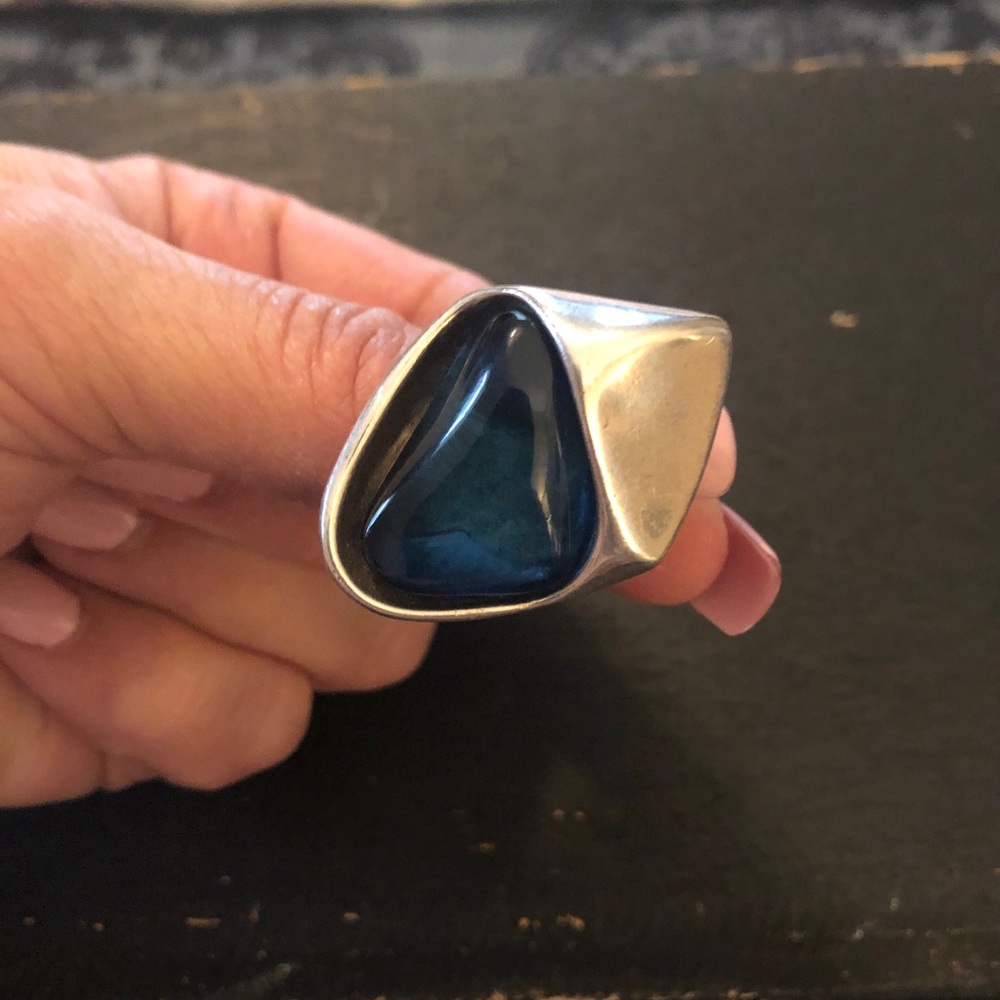 Uno De 50 ring with blue stone.